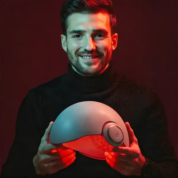 Man wearing The Man Hair LED therapy helmet